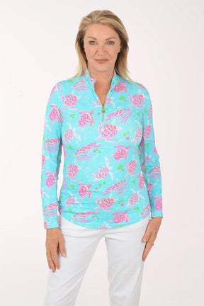 Woman wearing a colorful floral patterned shirt on a white background