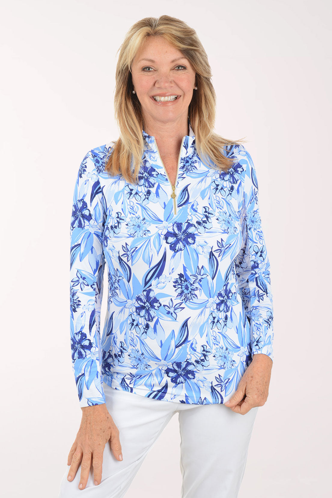 Woman wearing a blue floral patterned shirt on a white background