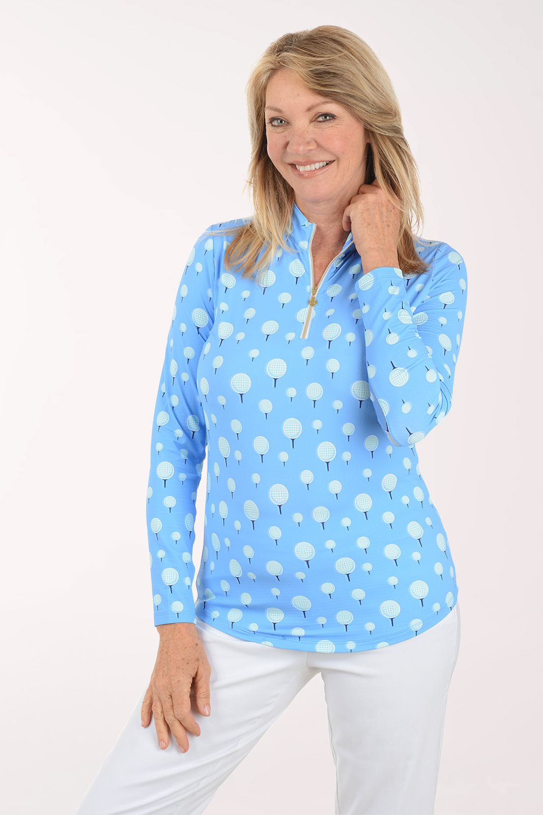 Woman wearing a light blue patterned long-sleeve shirt on a white background