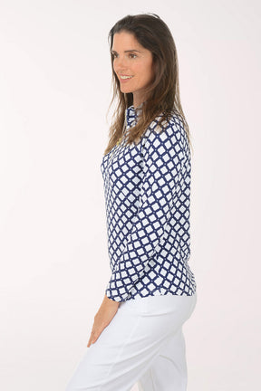 Woman wearing a blue and white patterned shirt on a white background