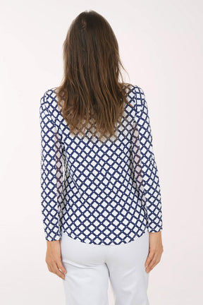 Woman wearing a blue and white patterned shirt on a white background