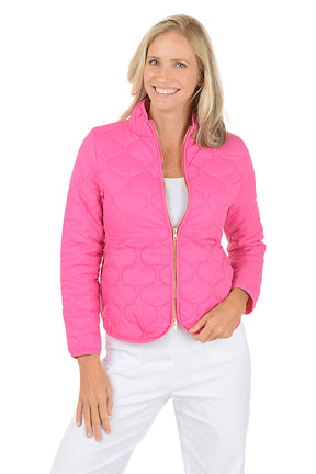 A woman wearing a pink quilted puffer jacket.