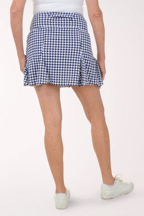 Person wearing a blue and white checkered skirt on a white background