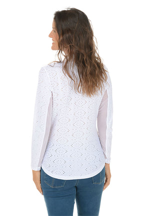 Woman wearing a white long-sleeve top with mesh panels on a white background. Back shot.