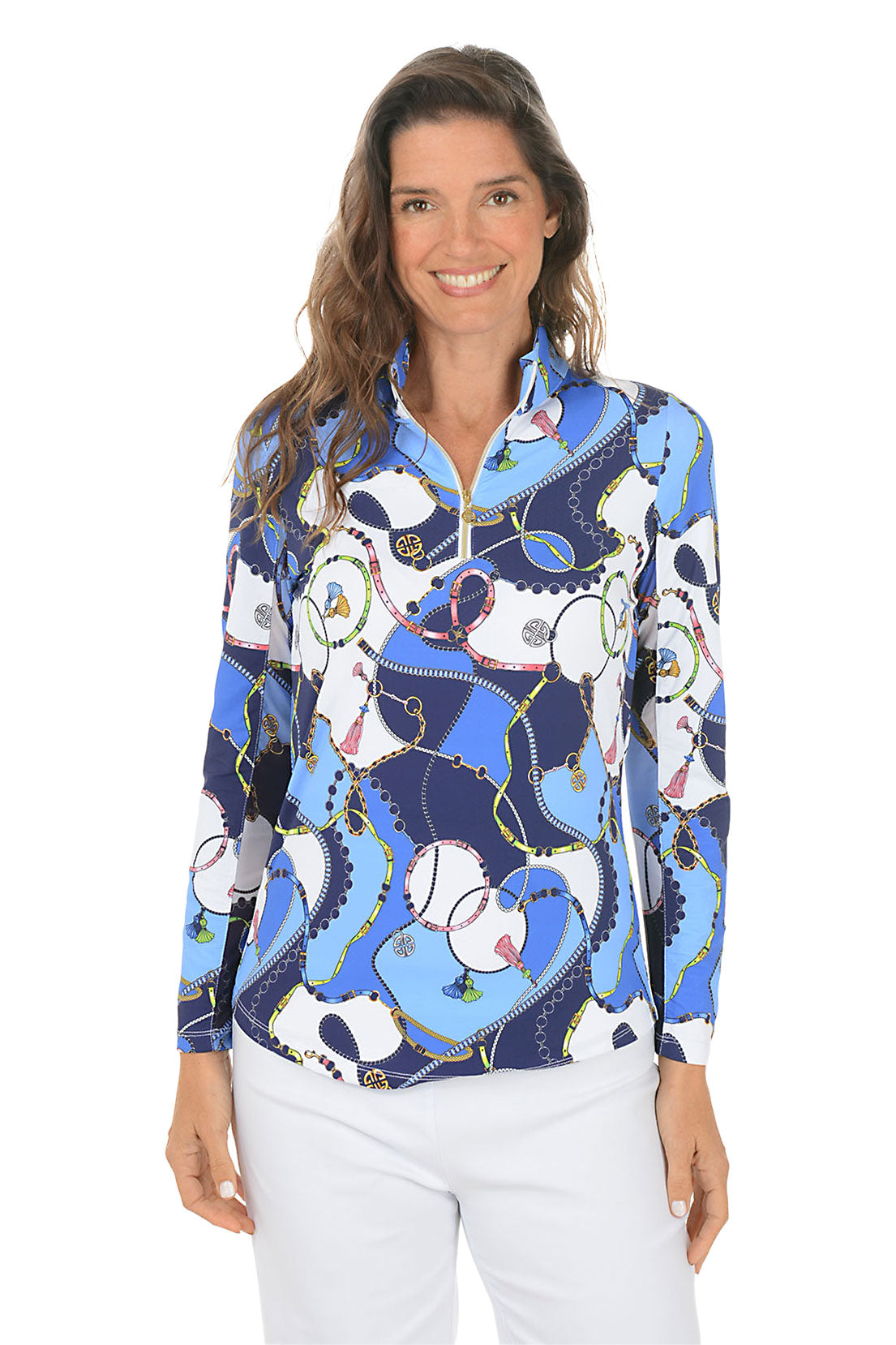 Woman wearing a colorful patterned shirt with a white background.