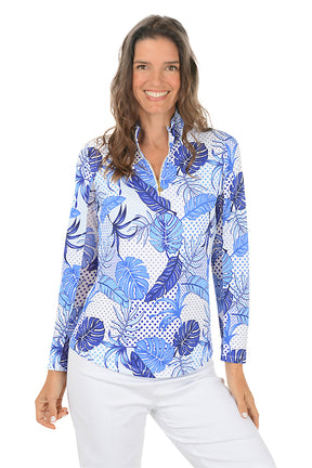 Woman wearing a blue floral patterned shirt on a white background