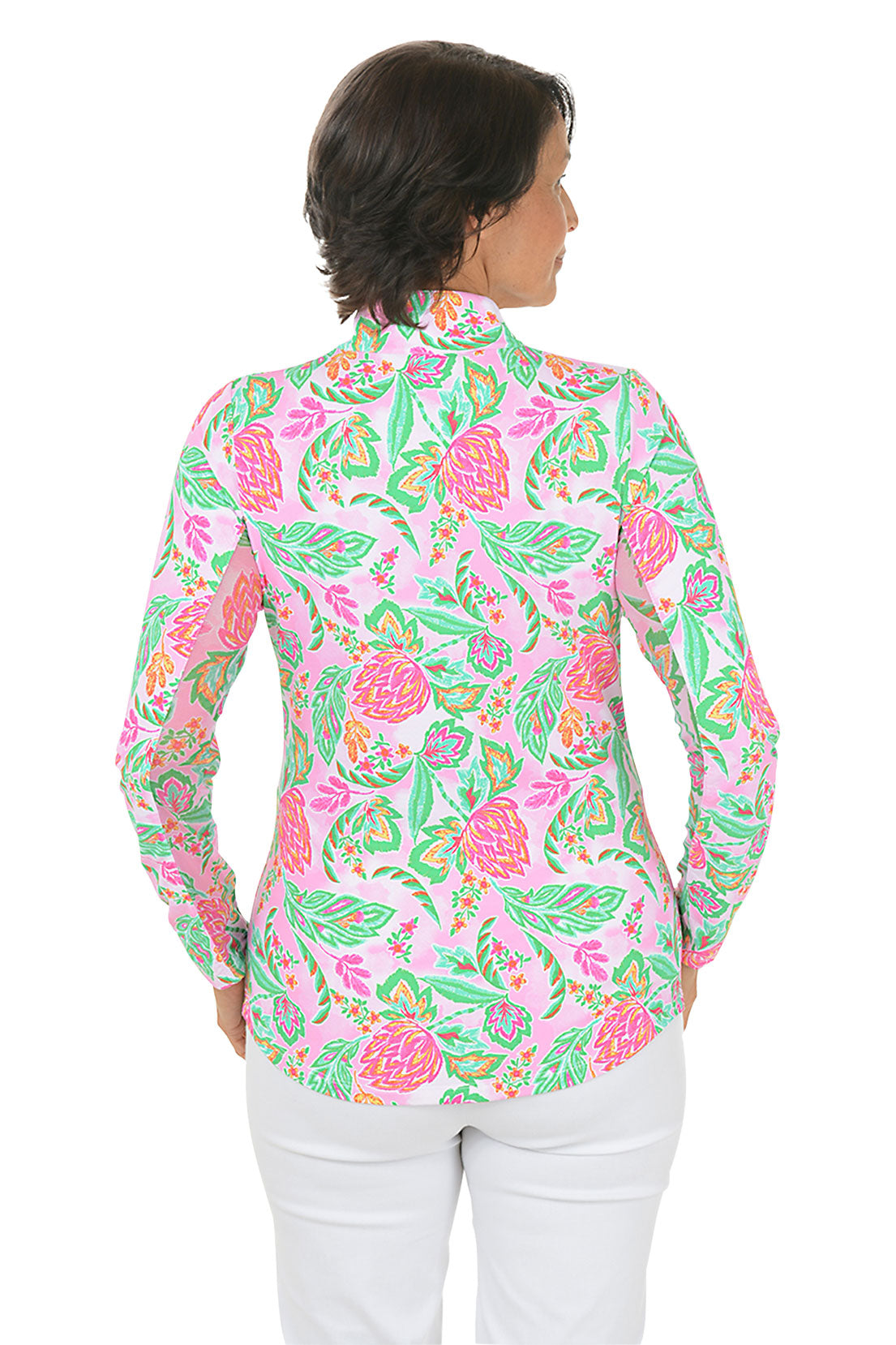 Woman wearing a colorful floral blouse on a white background. Back shot.