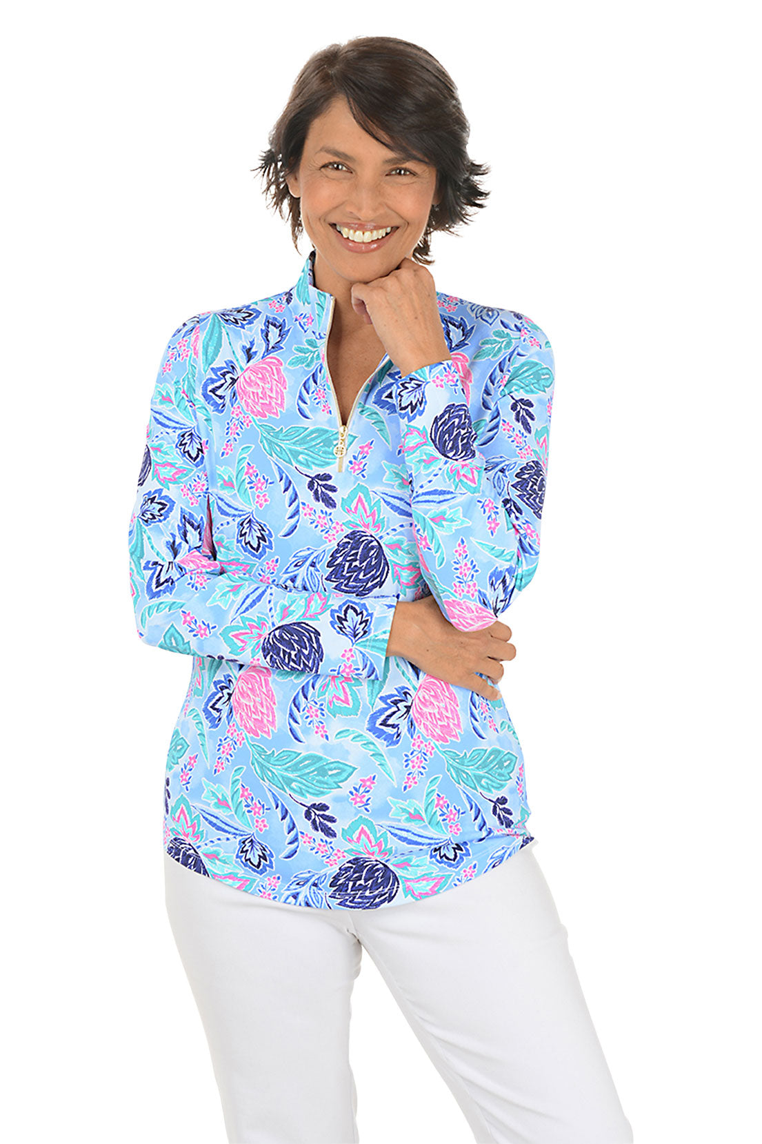 Woman wearing a colorful floral blouse with a white background