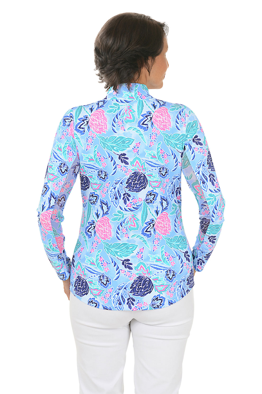 Woman wearing a colorful floral blouse on a white background. Back shot.