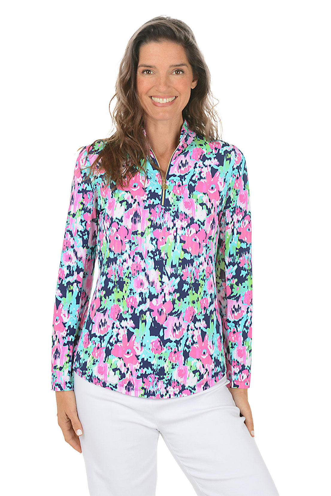 Woman wearing a colorful floral blouse with long sleeves on a white background