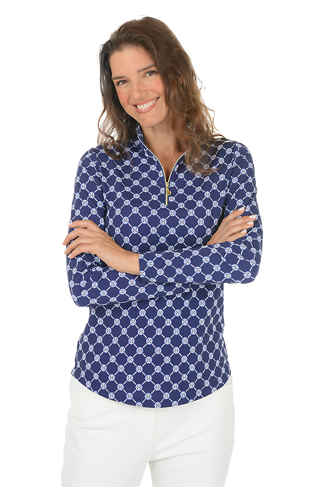Woman wearing a blue patterned long-sleeve shirt with a white background.