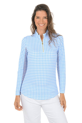 Woman wearing a blue and white checkered long-sleeve shirt with mesh sleeves on a white background.