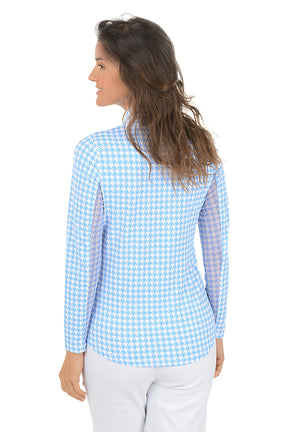 Woman wearing a blue and white checkered long-sleeve shirt with mesh sleeves on a white background. Back shot.
