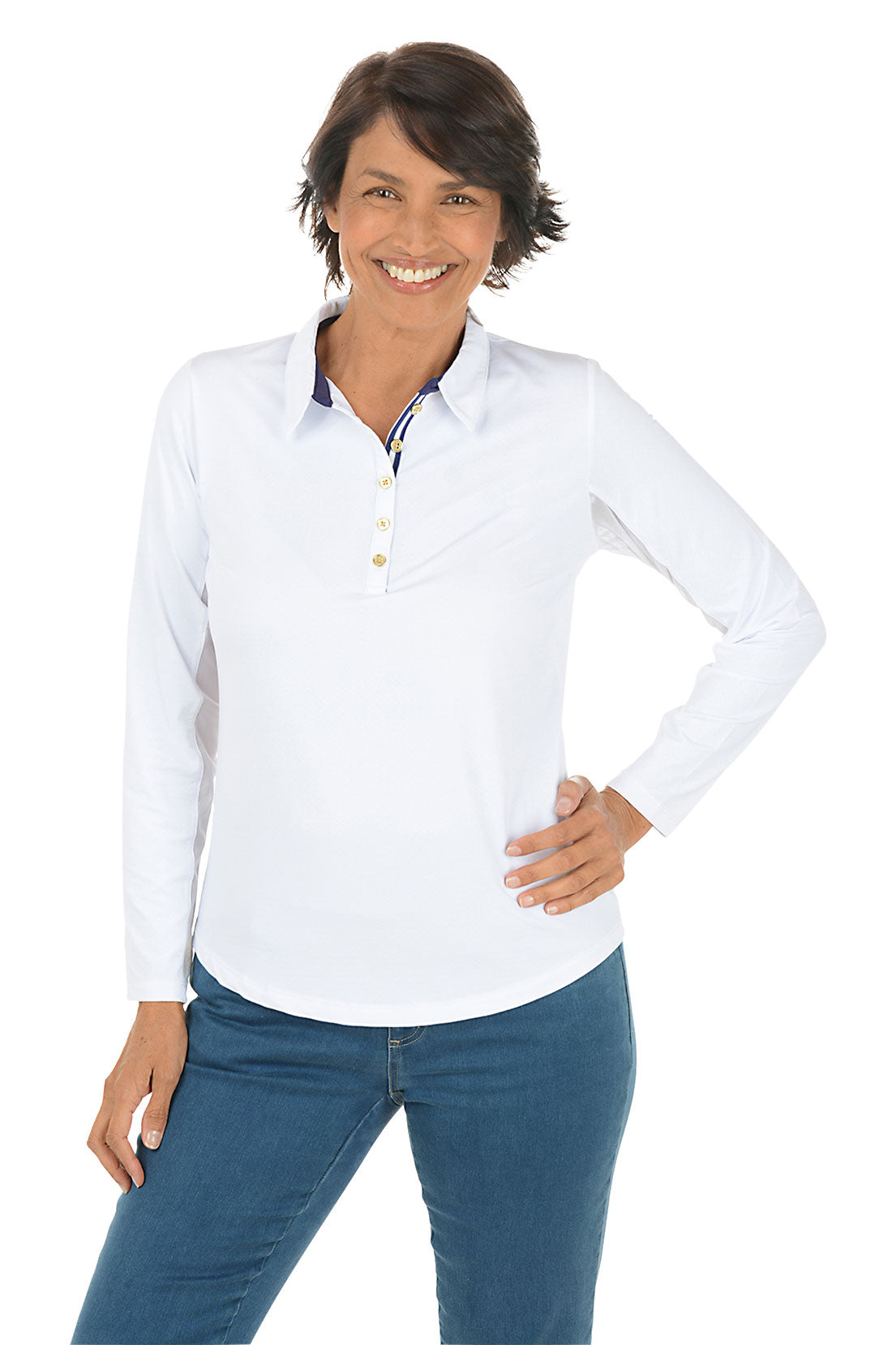 Woman wearing a white long-sleeve shirt and blue jeans on a white background.
