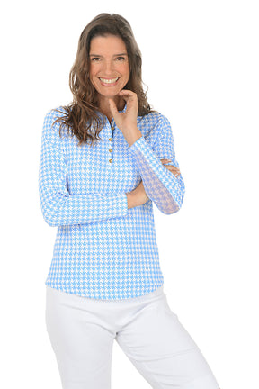 Woman wearing a blue checkered shirt on a white background.