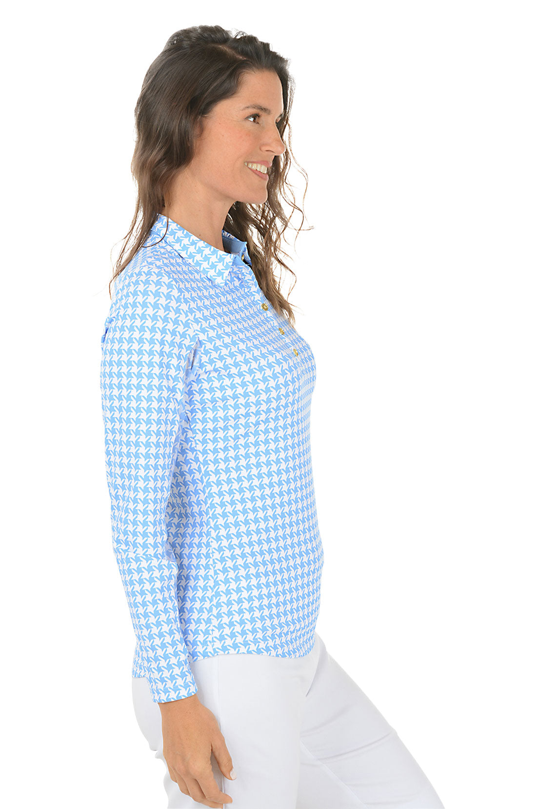 Woman wearing a blue checkered shirt on a white background. Side shot.