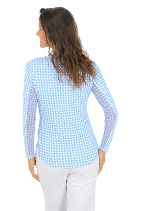 Woman wearing a blue checkered shirt on a white background. Back shot.