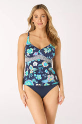 Woman wearing a floral-patterned swimsuit on a white background