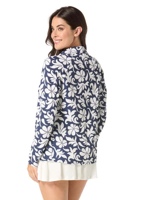 Woman wearing a blue floral patterned shirt on a white background