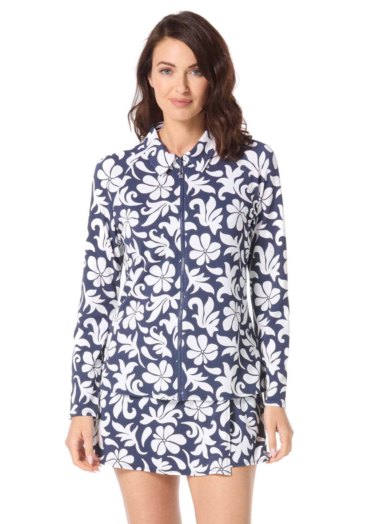Woman wearing a navy floral dress on a white background