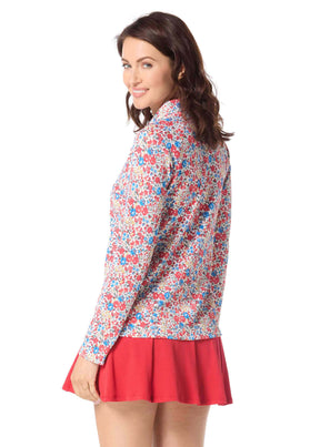 Woman wearing a floral blouse and red skirt on a white background