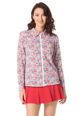 Woman wearing a floral blouse and red skirt on a white background