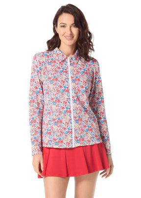 Woman wearing a floral blouse and red skirt on a white background