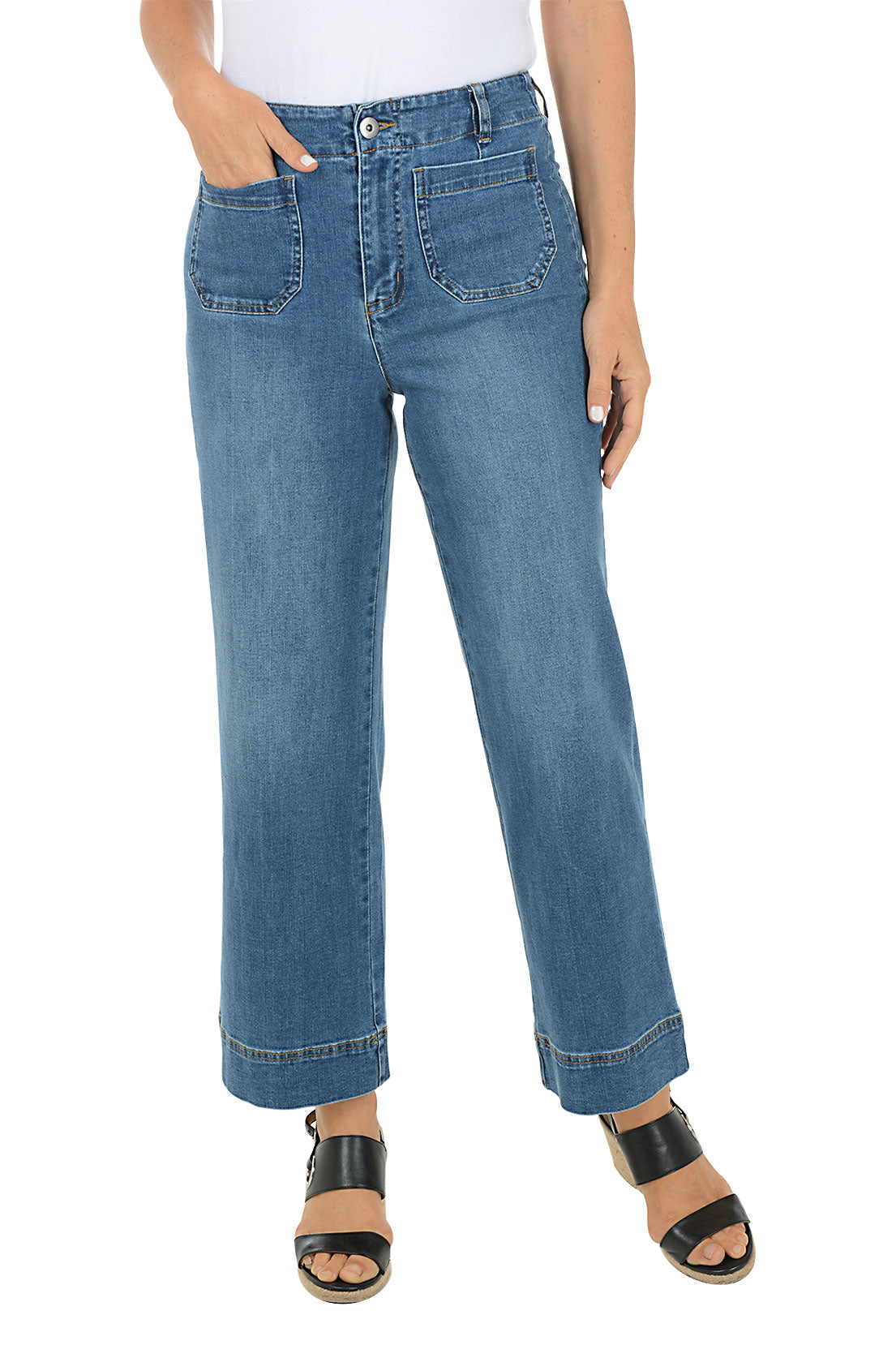 Person wearing blue jeans on a white background.