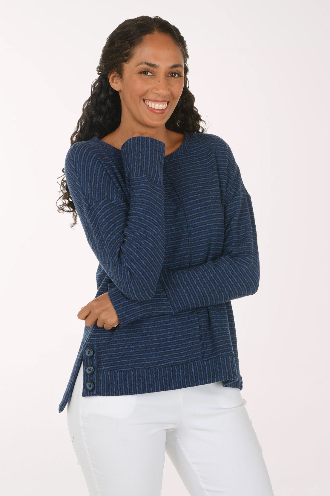 Woman wearing a blue striped long sleeve pullover top