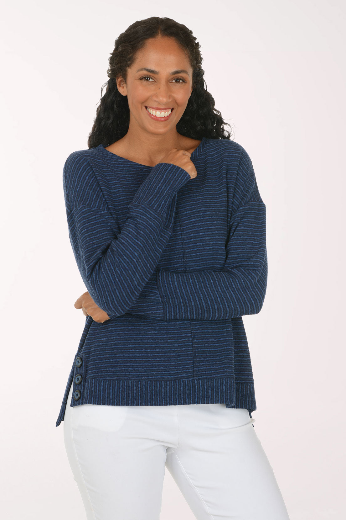 Woman wearing a blue striped long sleeve pullover top