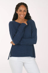 Woman wearing a blue striped long sleeve pullover top
