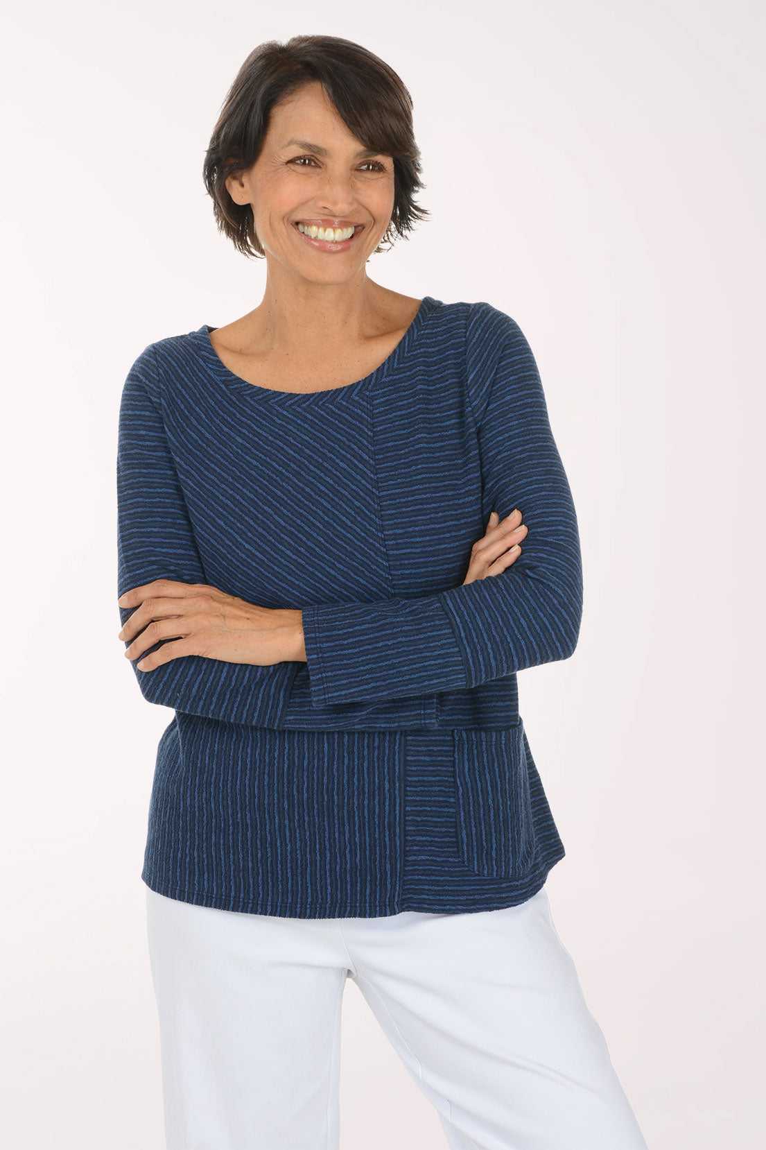 Woman wearing a blue striped long sleeve shirt 