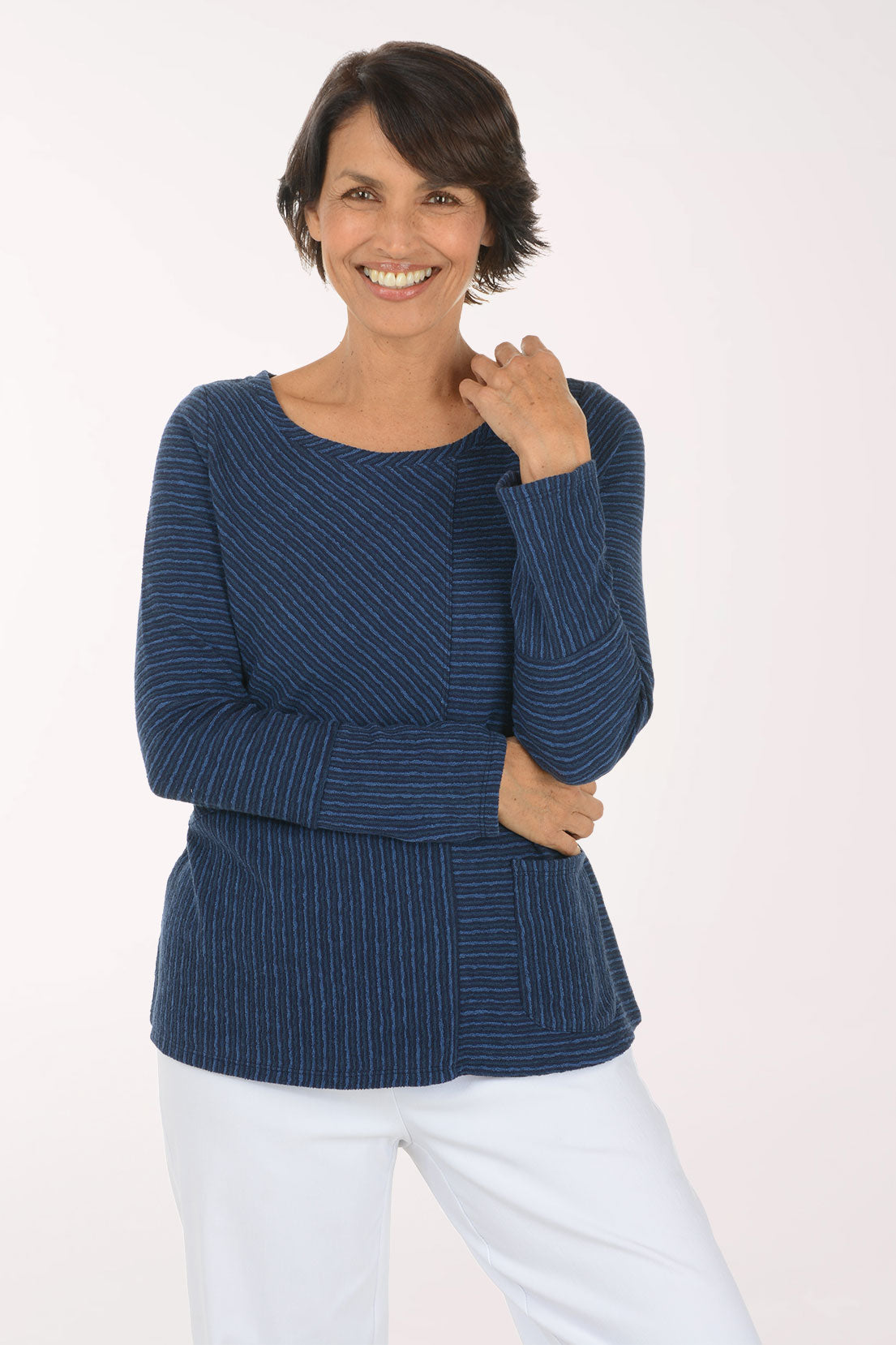 Woman wearing a blue striped long sleeve shirt 