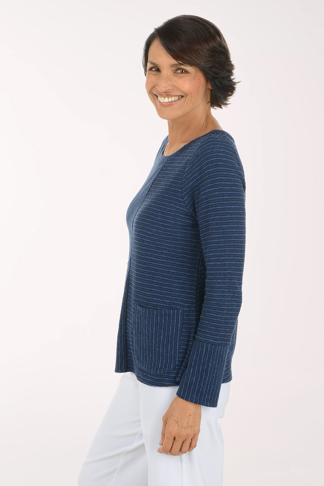 Woman wearing a blue striped long sleeve shirt 