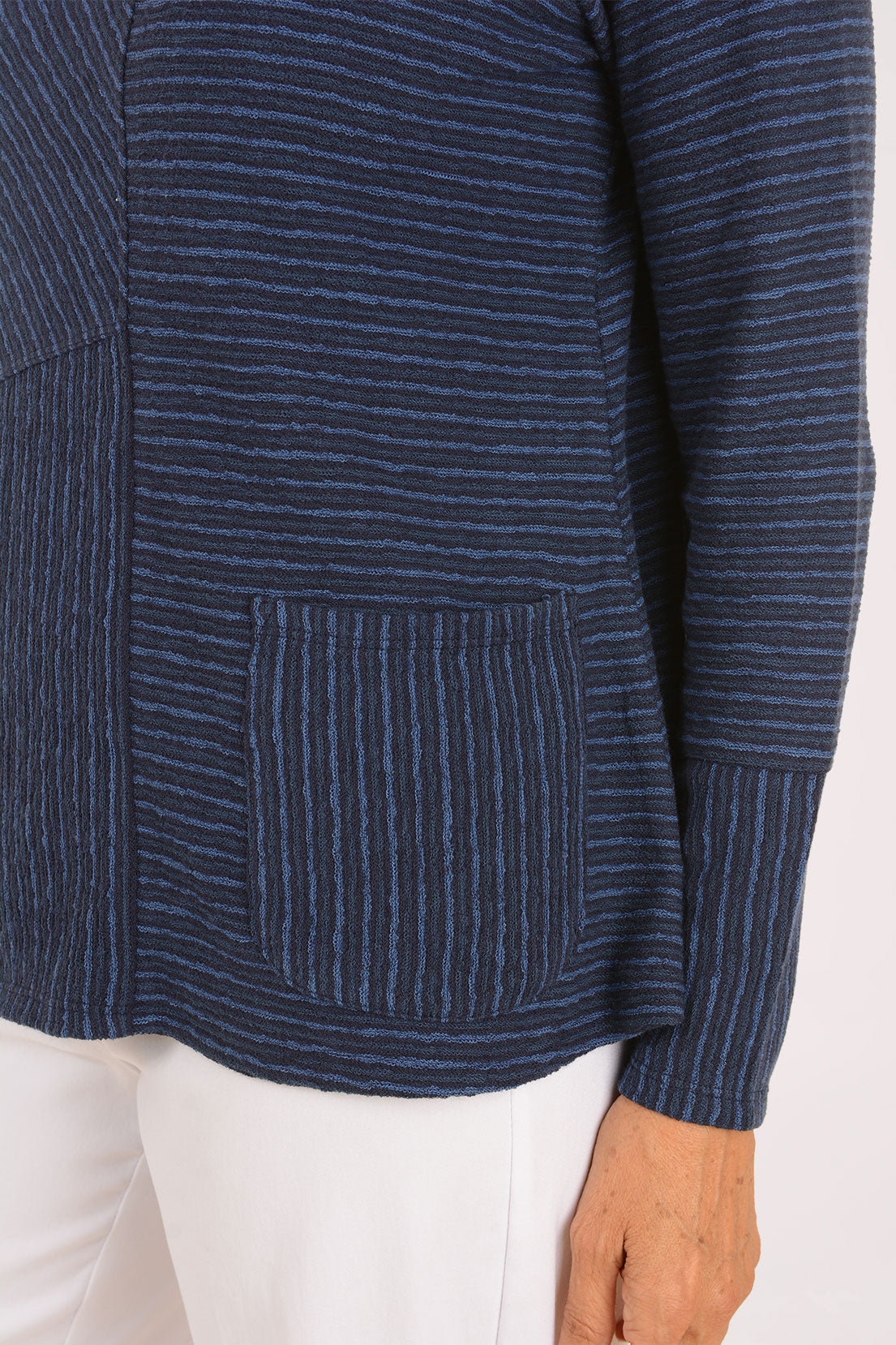 Woman wearing a blue striped long sleeve shirt - pocket detail 