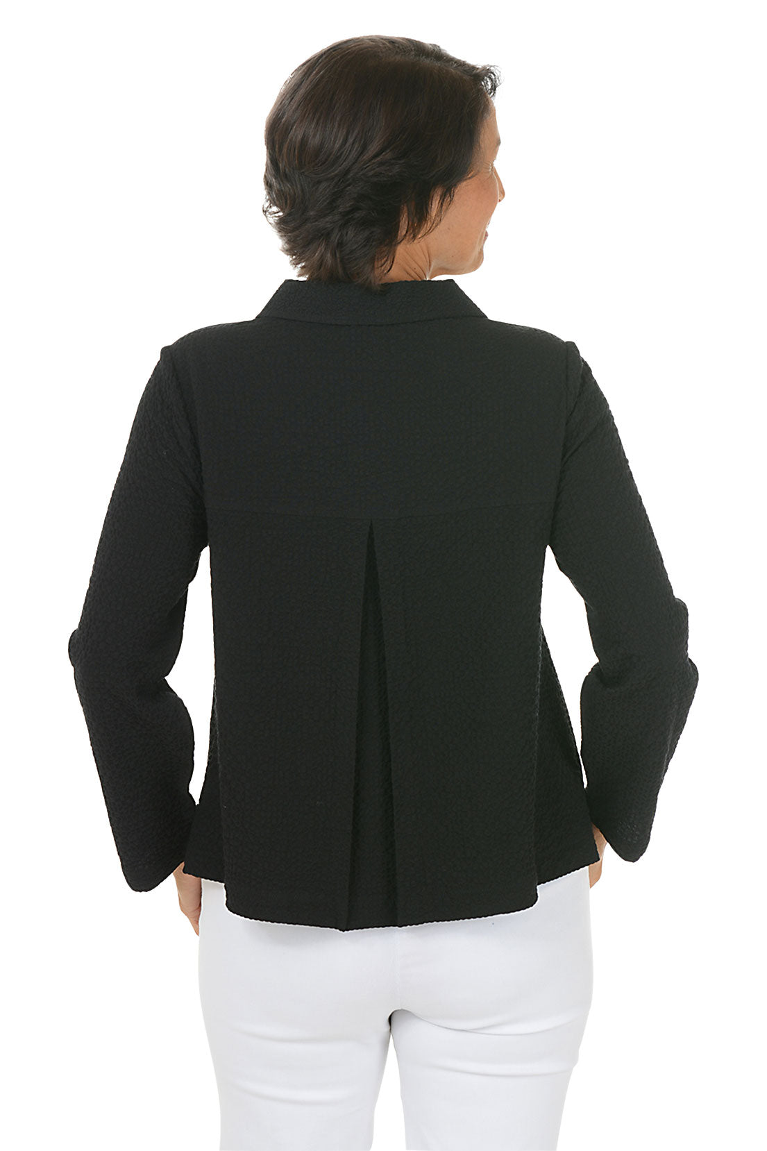 Woman wearing a black collared jacket with button details on a white background. Back shot.
