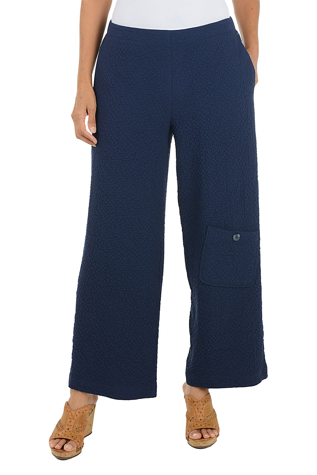 Navy blue wide-leg pants worn by a person on a white background.