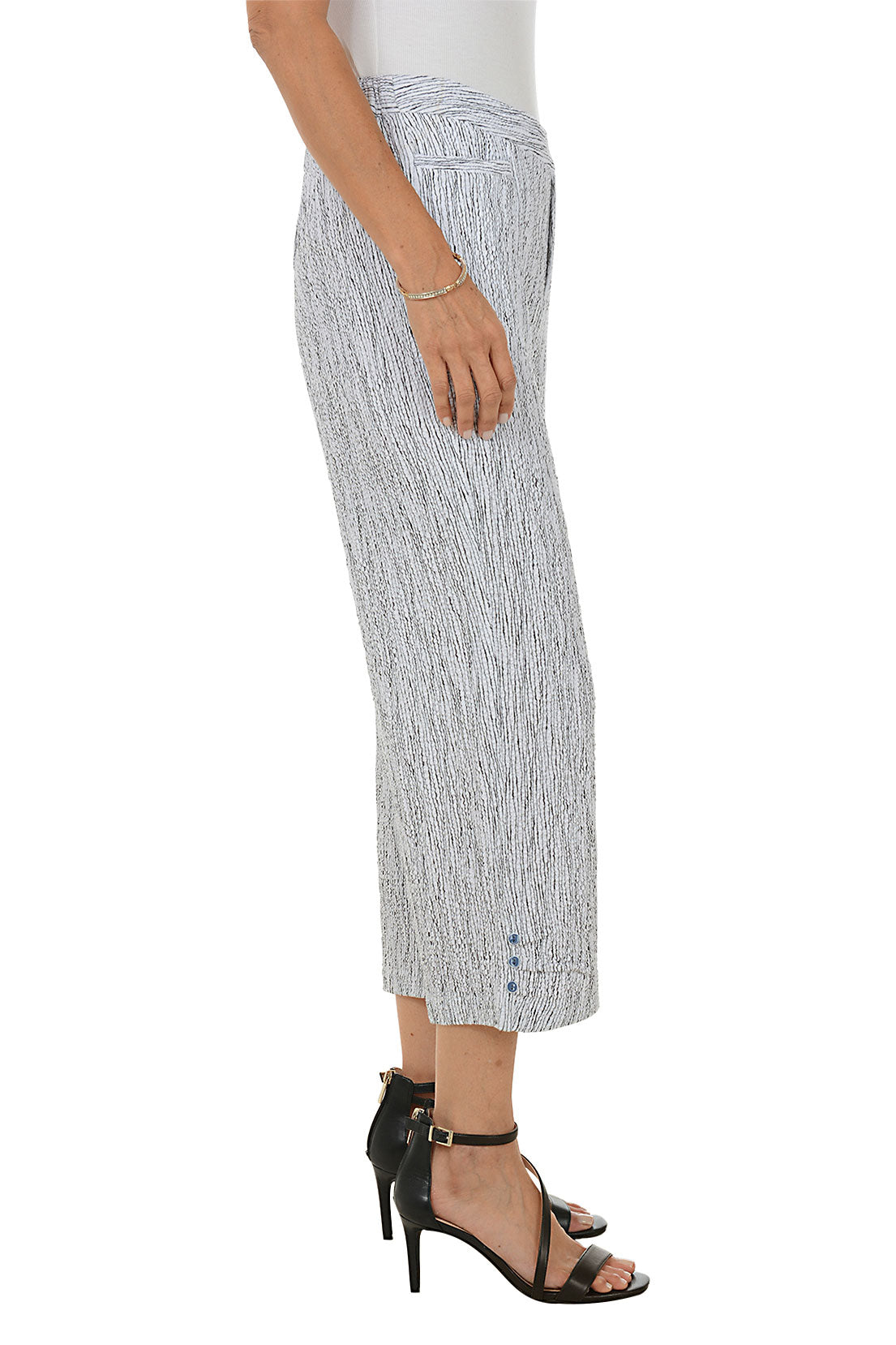 Woman wearing a patterned wide-leg pants on a white background