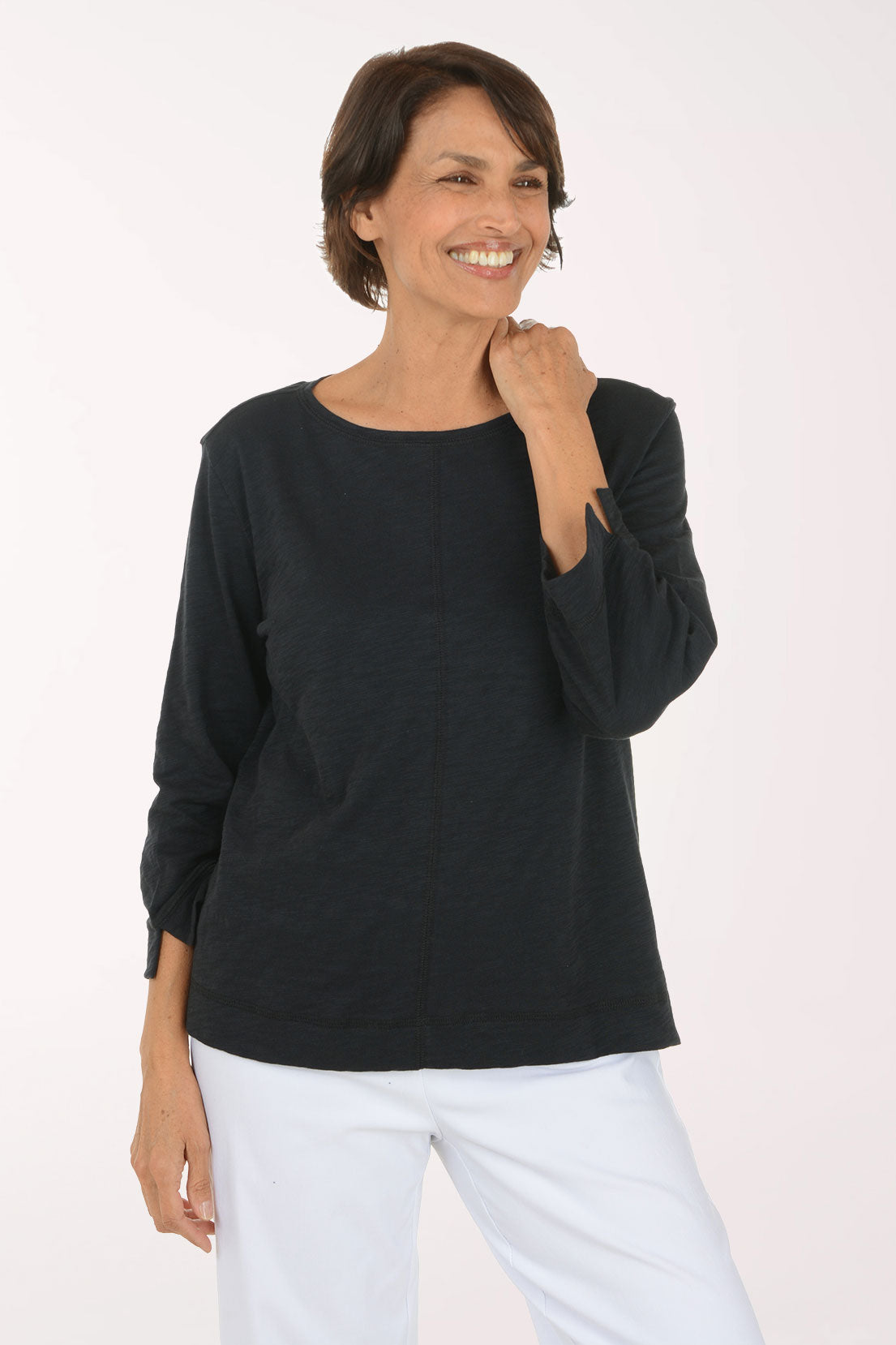 Woman wearing a black 3/4 sleeve boat neck top