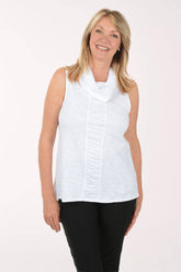 Woman wearing a white sleeveless top with a cowl neckline on a white background