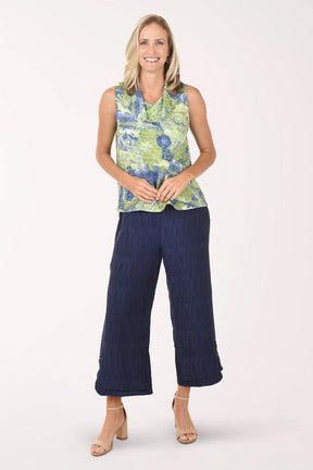 Navy blue textured pants worn by a person on a white background