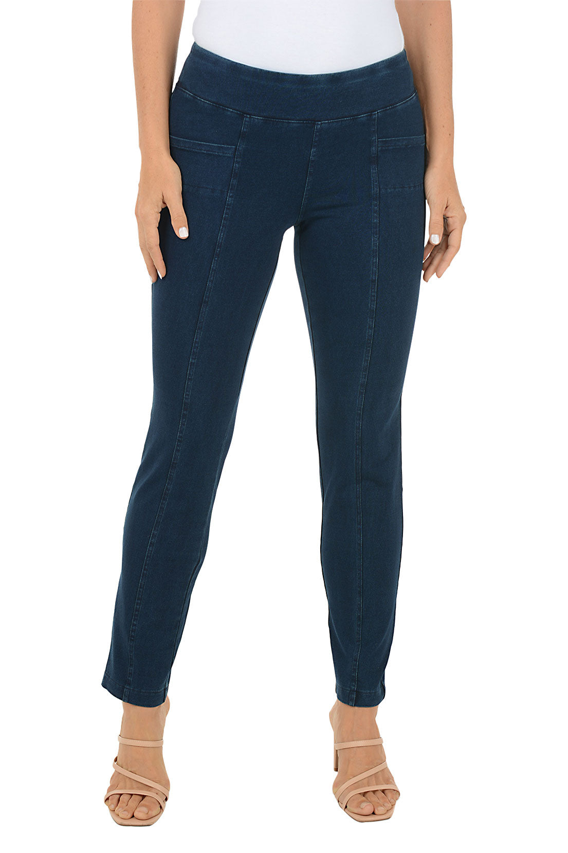 Dark blue jeans worn by a person on a white background.