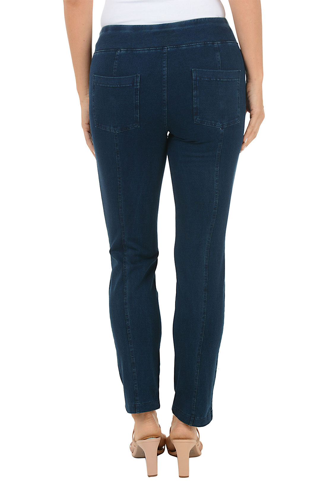 Dark blue jeans worn by a person on a white background. Back shot.