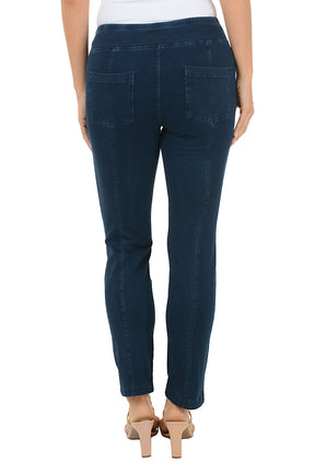 Dark blue jeans worn by a person on a white background. Back shot.