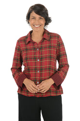Woman wearing a red plaid shirt on a white background.