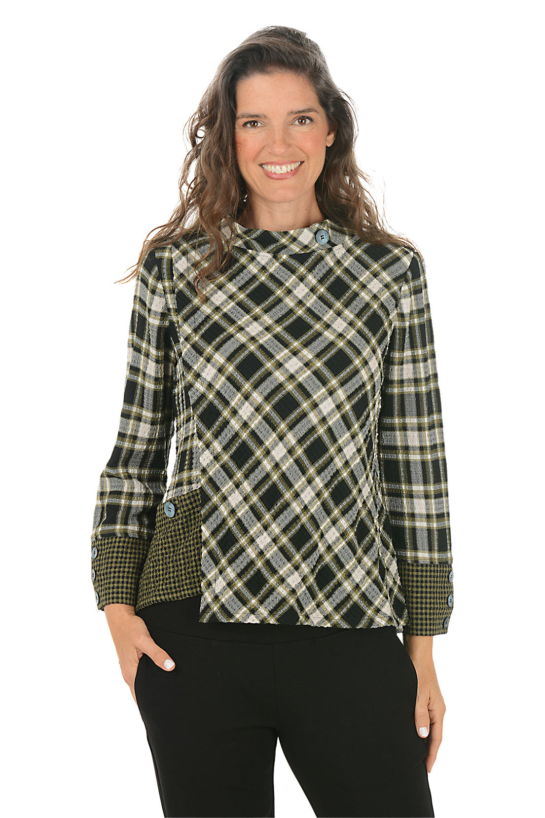 Woman wearing a green and black contrasting plaid shirt on a white background.