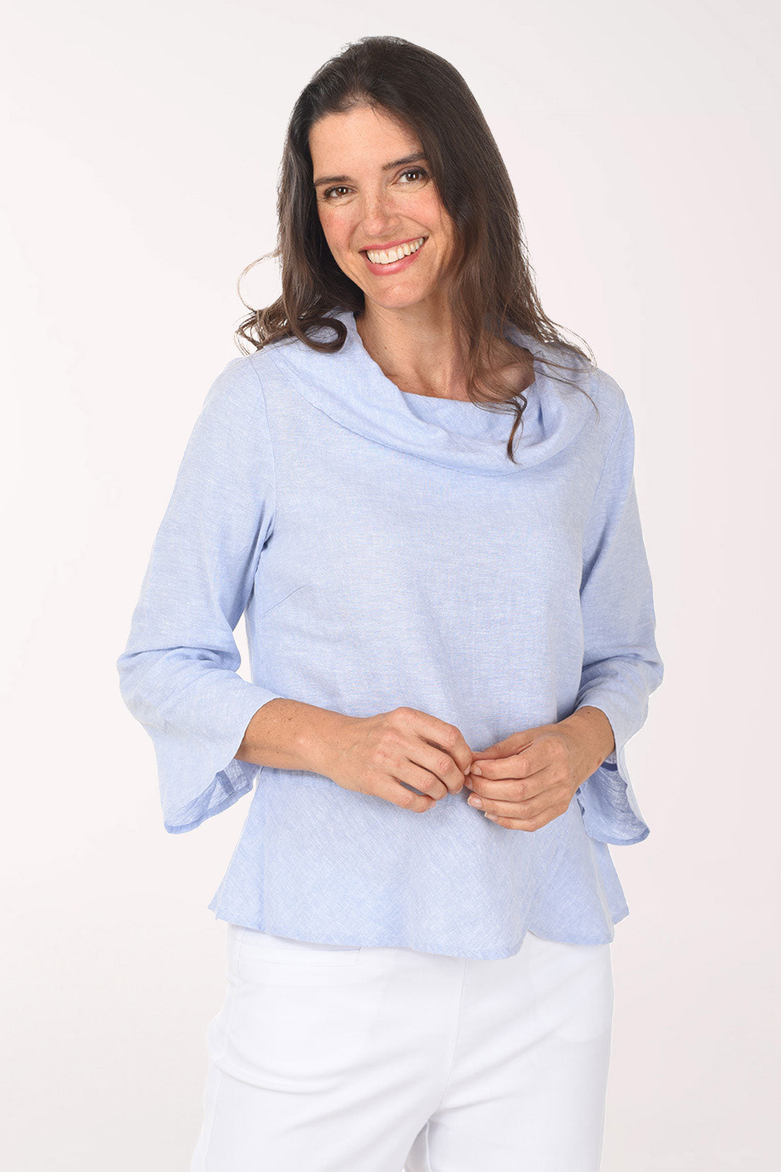 Woman wearing a light blue sweater on a white background