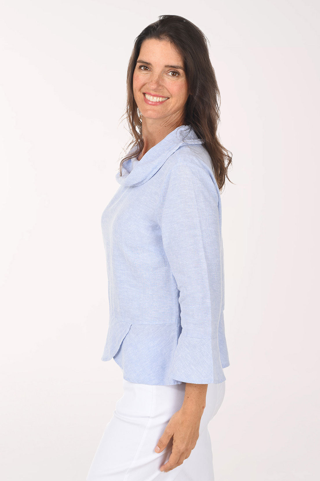 Woman wearing a light blue sweater on a white background