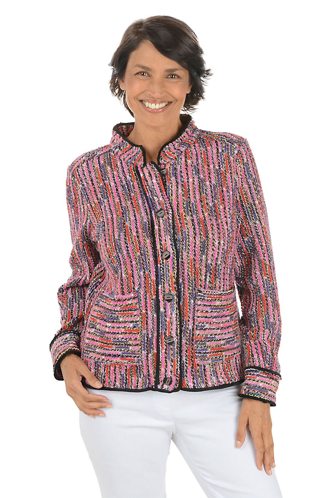 Woman wearing a colorful textured jacket on a white background.