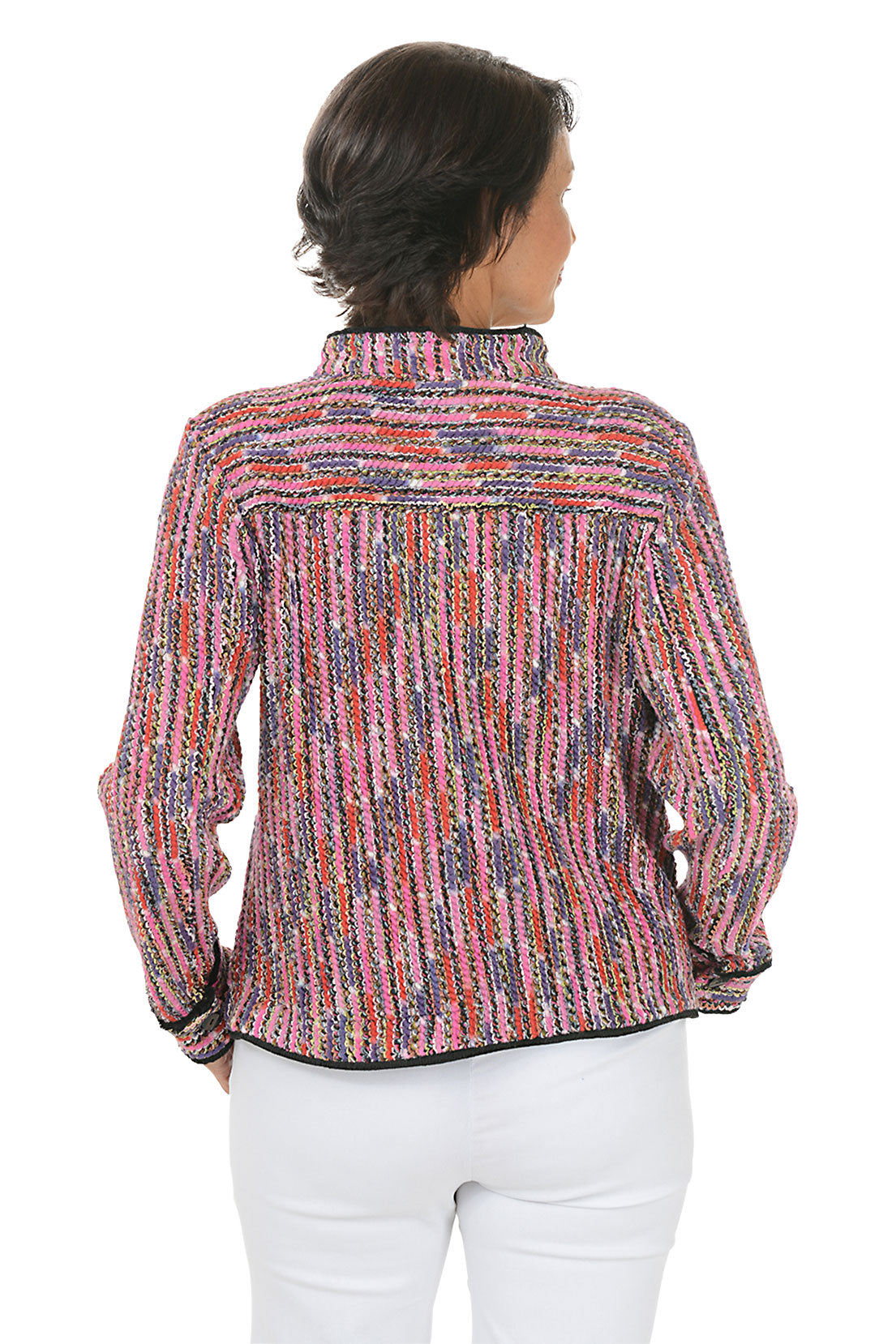 Woman wearing a colorful textured jacket on a white background. Back shot.